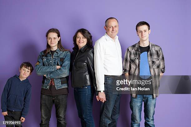 portrait of family of five in front of purple background - family on coloured background stock pictures, royalty-free photos & images