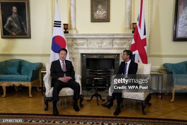 Britain's Prime Minister Rishi Sunak listens to the President of South Korea Yoon Suk Yeol make some remarks to the media at the start of their...