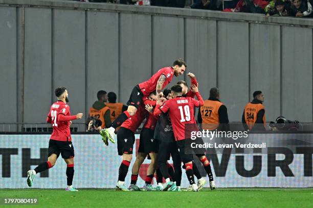 Khvicha Kvaratskhelia of Georgia celebrates with teammates after scoring the team's second goal during the UEFA EURO 2024 European qualifier match...