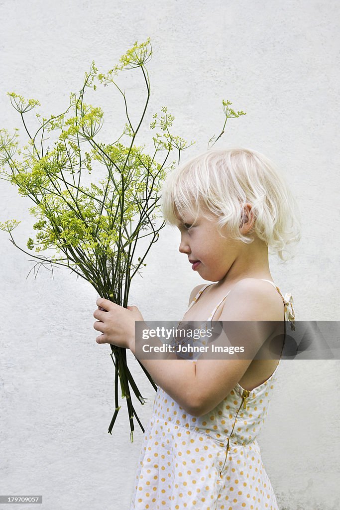 Girl holding fennel bouquet