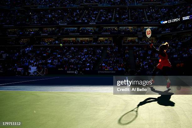 Serena Williams of United States of America plays a backhand during her women's singles semifinal match against Na Li of China on Day Twelve of the...