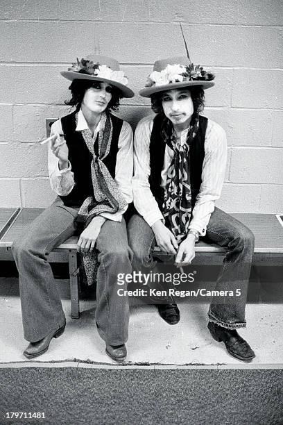 Musicians Bob Dylan and Joan Baez are photographed backstage at Madison Square Garden during the Rolling Thunder Revue on December 8, 1975 in New...