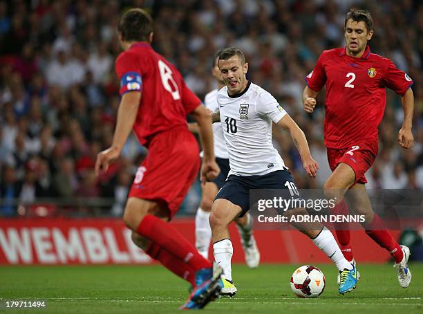 England's Jack Wilshere runs with the ball against Moldova during the World Cup 2014 Group H qualifying football match between England and Moldova at...