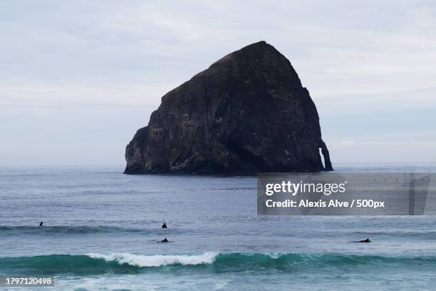 scence view of sheltering rock in the sea,pacific city,oregon,united states,usa - tillamook rock light stock pictures, royalty-free photos & images