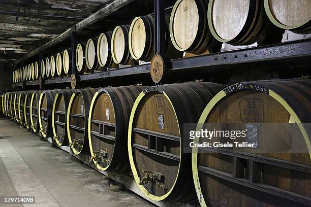 Barrels of Calvados are stored at the production facility of Calvados Morin in the Lower Normandy region on August 13, 2013 in Ivry-la-Bataille,...