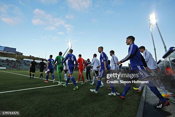 The teams walk on the pitch prior to the UEFA Under21 Euro 2015 Qualifier match between Faroe Islands and Germany at Torsvollur Stadium on September...