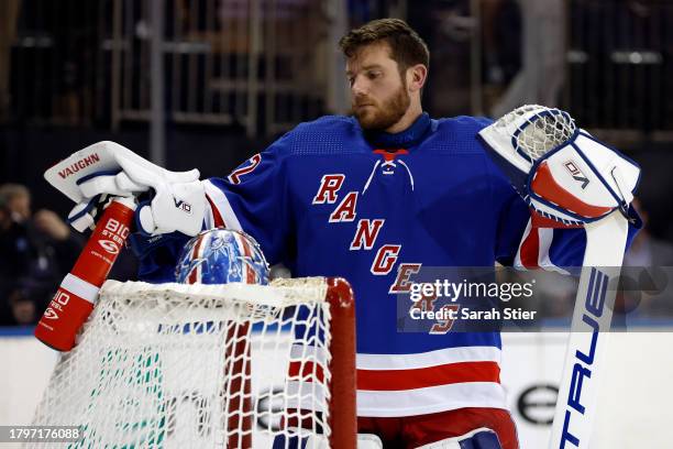Jonathan Quick of the New York Rangers grabs his puck during the first period against the Columbus Blue Jackets at Madison Square Garden on November...