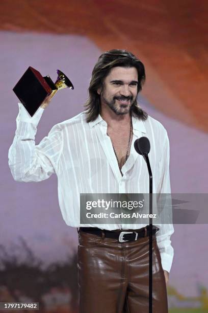 Juanes accepts the award for Best pop/rock album onstage during the Premiere Ceremony for The 24th Annual Latin Grammy Awards on November 16, 2023 in...