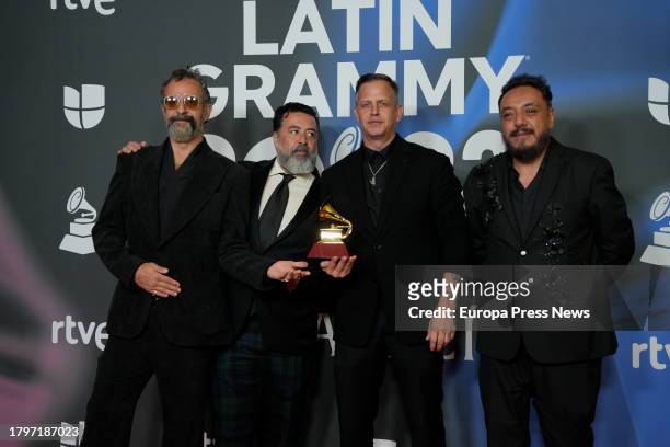 The group Molotov poses with the Grammy for best rock album, which was awarded during the Latin Grammy 2023 gala awards ceremony at the Palacio de...