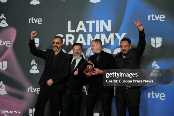 The group Molotov poses with the Grammy for best rock album, which was awarded during the Latin Grammy 2023 gala awards ceremony at the Palacio de...