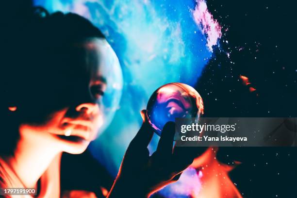 an imaginary image of an astronaut holding a small copy of a planet in outer space - rover stock pictures, royalty-free photos & images