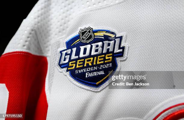 Detailed view is seen of the 2023 NHL Global Series patch on a Detroit Red Wings jersey in the locker room before the 2023 NHL Global Series in...