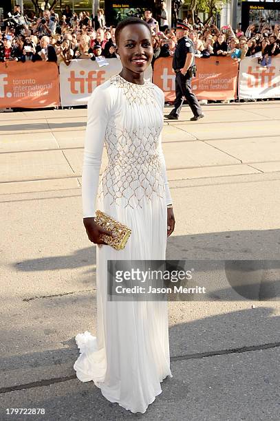 Actress Lupita Nyong'o arrives at the "12 Years A Slave" Premiere during the 2013 Toronto International Film Festival Princess of Wales Theatre on...