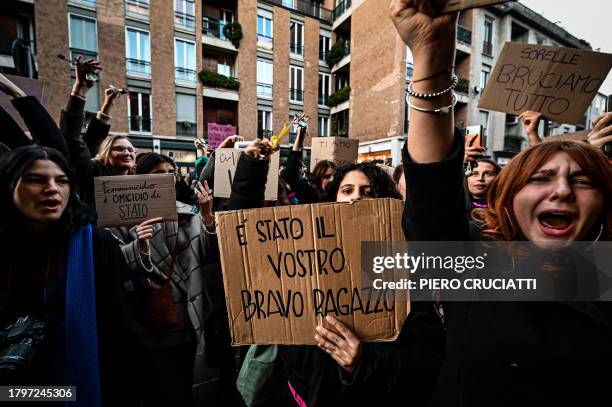 Woman holds a placard reading 'It was your good boy' outside the University of Milan during a demonstration following the suspected feminicide of...