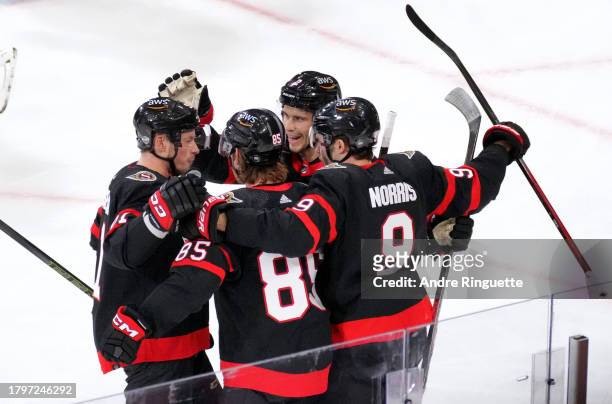 Vladimir Tarasenko, Jake Sanderson, Artem Zub and Josh Norris of the Ottawa Senators celebrate after a first period goal during the 2023 NHL Global...
