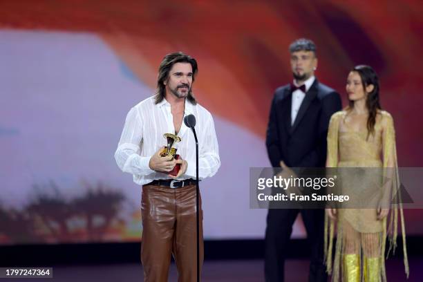 Juanes accepts the award for Best pop/rock album onstage during the Premiere Ceremony for The 24th Annual Latin Grammy Awards at FIBES Conference and...