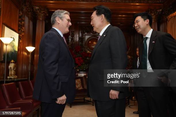 Labour Party leader Sir Keir Starmer talks with the President of South Korea Yoon Suk Yeol as they meet at the Four Seasons Hotel on November 22,...