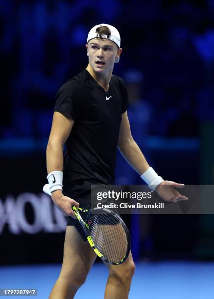 Holger Rune of Denmark reacts against Jannik Sinner of Italy during the Men's Singles Round Robin match on day five of the Nitto ATP Finals at Pala...