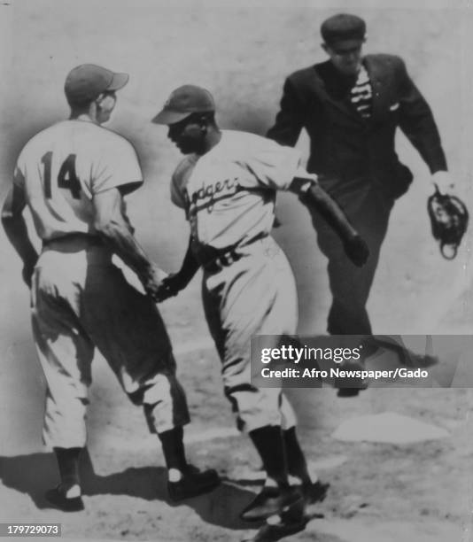 National Leaguers got their kicks when American baseball player Jackie Robinson of the Brooklyn Dodgers belted his third home run in two days to lead...