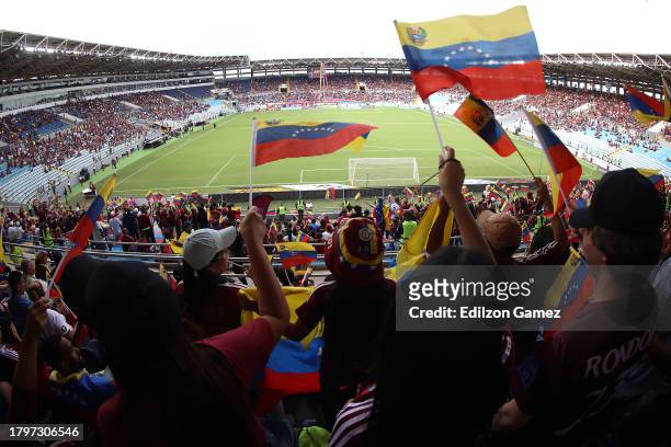 Fans of Venezuela wave flags prior to a FIFA World Cup 2026 Qualifier match between Venezuela and Ecuador at Estadio Monumental de Maturin on...