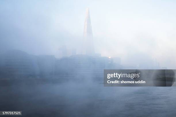 south london skyline in winter fog - mystery stock pictures, royalty-free photos & images