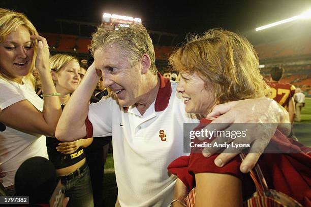 Head coach Pete Carroll of USC celebrates the victory over Iowa with wife Glena and daughter Jaime after the FedEx Orange Bowl at Pro Player Stadium...