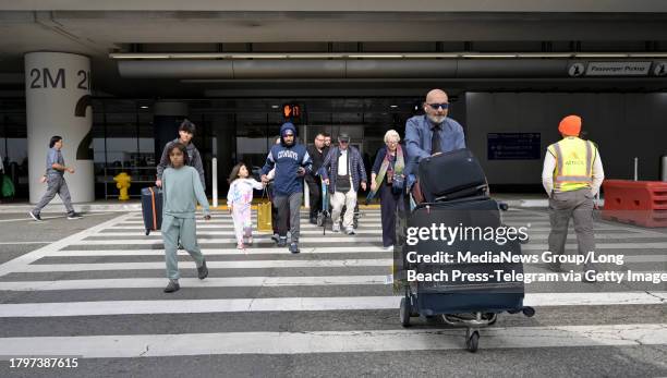 Los Angeles, CA Travelers arrive at Los Angeles International Airport the week before Thanksgiving in Los Angeles on Thursday, November 16, 2023.