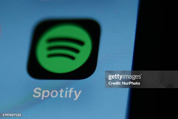 Spotify icon displayed on a phone screen is seen in this illustration photo taken in Krakow, Poland on November 22, 2023.