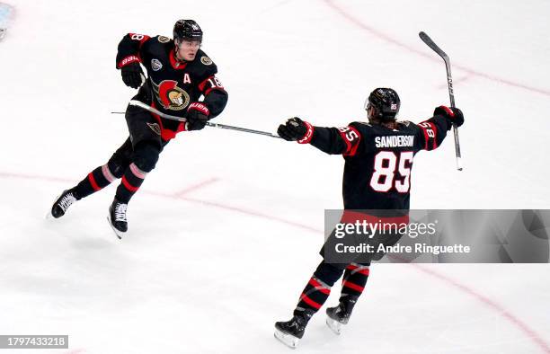 Jake Sanderson and Tim Stutzle of the Ottawa Senators react after Stutzle scored in the overtime period of the 2023 NHL Global Series in Sweden...