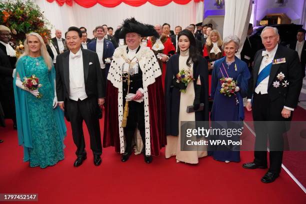 Lord Mayor of the City of London Professor Michael Mainelli stands with his wife Elisabeth Mainelli President of South Korea, Yoon Suk Yeol, and his...