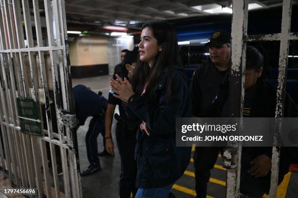 Marcela Blanco , a member of the Semilla Party, arrives handcuffed to a hearing at the Palace of Justice in Guatemala City on November 22, 2023....