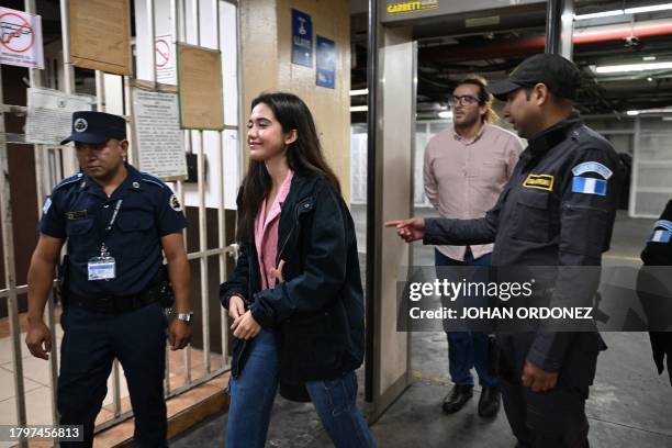 Marcela Blanco , a member of the Semilla Party, arrives handcuffed to a hearing at the Palace of Justice in Guatemala City on November 22, 2023....