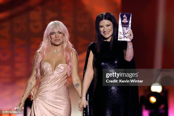 Karol G and Laura Pausini pose with the Latin Recording Academy Person of the Year award onstage during The 24th Annual Latin Grammy Awards on...