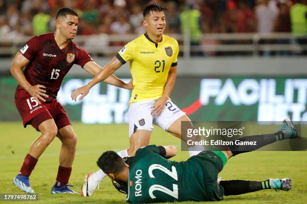 Rafael Romo of Venezuela makes a save as Alan Franco of Ecuador reacts during a FIFA World Cup 2026 Qualifier match between Venezuela and Ecuador at...