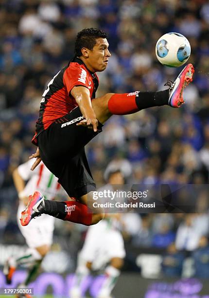 Victor Aquino of Newell's Old Boys jumps for the ball during a match between Velez Sarsfield and Newell's Old Boys as part of the sixth round of...