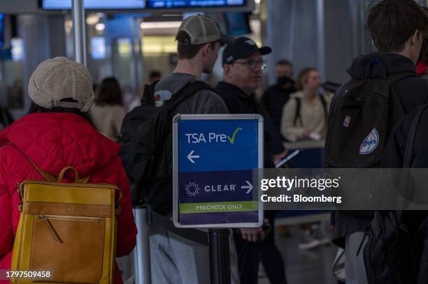 Travelers enter a security checkpoint at San Francisco International Airport in San Francisco, California, US, on Wednesday, Nov. 22, 2023. As many...