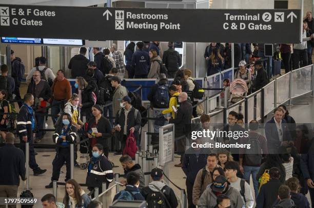 Travelers at San Francisco International Airport in San Francisco, California, US, on Wednesday, Nov. 22, 2023. As many as 4.7 million people are...