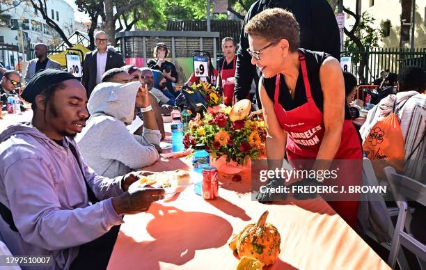 Los Angeles Mayor Karen Bass meets attendees during the annual LA Mission Thanksgiving meal on Skid Row in Los Angeles, California on November 22,...