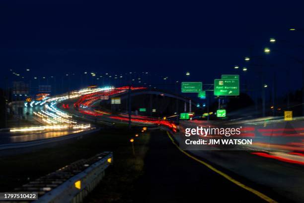 Cars cross the Kent Narrows Bridge in Grasonville, Maryland, on November 22, 2023 ahead of the Thanksgiving holiday.