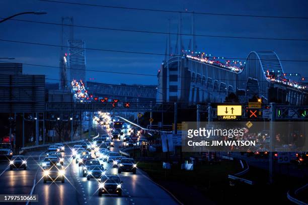Cars cross the Bay Bridge over the Chesapeake Bay in Stevensville, Maryland, on November 22, 2023 ahead of the Thanksgiving holiday.