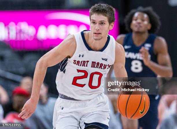 Aidan Mahaney of the St. Mary's Gaels brings the ball up court during the game against the Xavier Musketeers in the Continental Tire Main Event at...