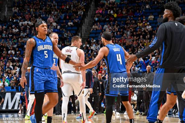 Paolo Banchero and Jalen Suggs of the Orlando Magic high five during the game against the Denver Nuggets on November 22, 2023 at Amway Center in...