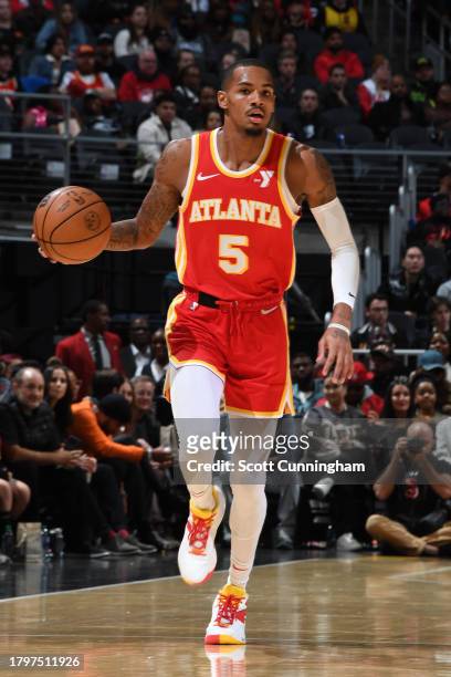 Dejounte Murray of the Atlanta Hawks dribbles the ball during the game against the Brooklyn Nets on November 22, 2023 at State Farm Arena in Atlanta,...