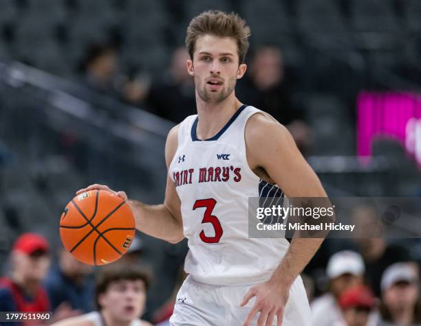 Augustas Marciulionis of the St. Mary's Gaels brings the ball up court during the game against the Xavier Musketeers in the Continental Tire Main...