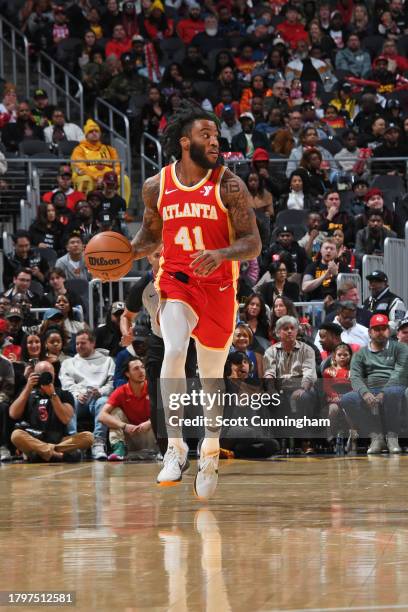 Saddiq Bey of the Atlanta Hawks dribbles the ball during the game against the Brooklyn Nets on November 22, 2023 at State Farm Arena in Atlanta,...