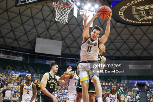 Tyler Kolek of the Marquette Golden Eagles hauls in a rebound during the second half of their game against the Purdue Boilermakers in the Allstate...