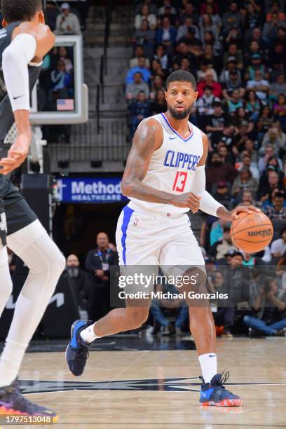 Paul George of the LA Clippers dribbles the ball during the game against the San Antonio Spurs on November 22, 2023 at the Frost Bank Center in San...