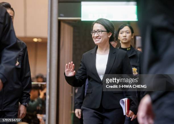 Democratic Progressive Party vice presidential candidate Hsiao Bi-khim waves to the media before attending a press conference at NTUH International...