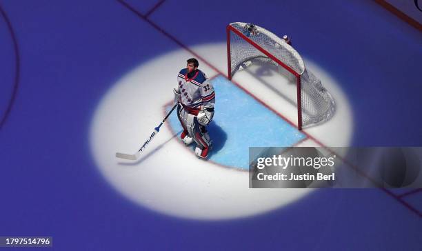 Jonathan Quick of the New York Rangers stands at attention for the National Anthem before the game against the Pittsburgh Penguins at PPG PAINTS...