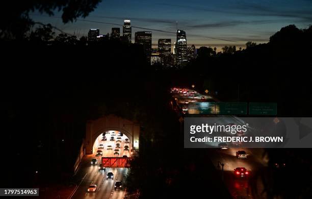 The Downtown Los Angeles skyline is seen as motorists make their way in and out of Los Angeles on November 22, 2023 as millions of people head to...